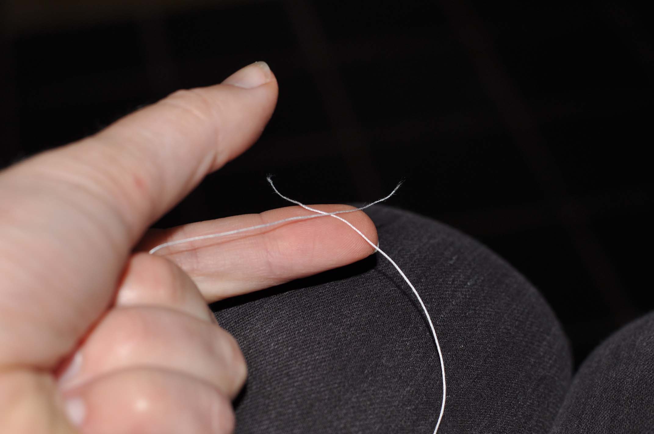 Place the thread of the right-hand bobbin under the thread of the left-hand bobbin.